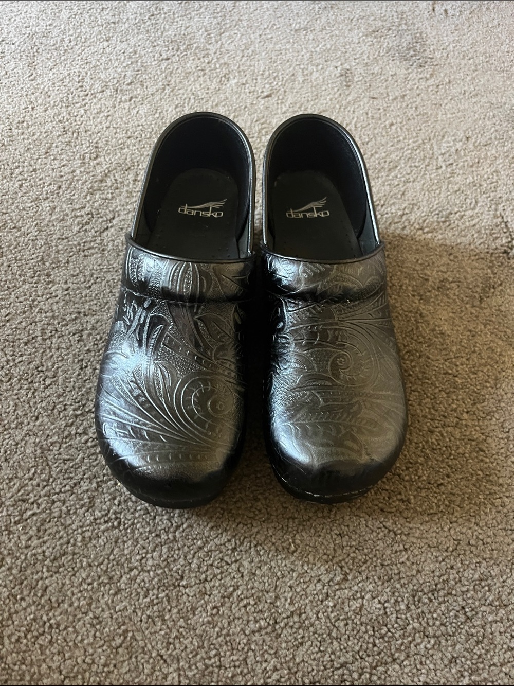 Dansko Black Embossed Slip-On Clogs